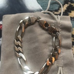 Men’s Silver Figaro chain bracelet.